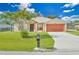 Single-story home with attached garage and landscaped lawn at 2073 Damascus Ln, Punta Gorda, FL 33983
