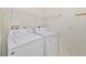 Laundry room with washer, dryer, and shelving at 2073 Damascus Ln, Punta Gorda, FL 33983