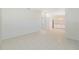Open living room with tile floors and kitchen access at 2073 Damascus Ln, Punta Gorda, FL 33983