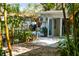 Relaxing backyard oasis with lush landscaping and patio area at 2207 Hickory Ave, Sarasota, FL 34234