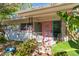 Mid-century modern home with pink door and string lights at 2207 Hickory Ave, Sarasota, FL 34234