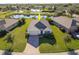 House situated in a community with a lake and other homes at 28214 Arrowhead Cir, Punta Gorda, FL 33982