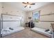 bedroom with twin beds, built in shelving and fun decor at 28214 Arrowhead Cir, Punta Gorda, FL 33982