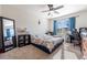 Bedroom with floral bedding, large mirror, and a workspace at 28214 Arrowhead Cir, Punta Gorda, FL 33982