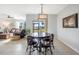 Bright dining room with a round table and chairs, overlooking a grassy backyard at 28214 Arrowhead Cir, Punta Gorda, FL 33982