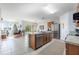 Spacious kitchen with island, stainless steel appliances, and views of living room at 28214 Arrowhead Cir, Punta Gorda, FL 33982
