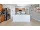 Open concept kitchen with island and stainless steel appliances at 28214 Arrowhead Cir, Punta Gorda, FL 33982