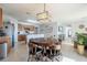 Kitchen with an island, wood cabinets, and a dining area at 28214 Arrowhead Cir, Punta Gorda, FL 33982