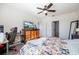 Main bedroom with a large bed, dresser, and home office space at 28214 Arrowhead Cir, Punta Gorda, FL 33982
