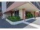 Exterior view of building entrance with landscaping and parking at 2901 26Th W St # 601, Bradenton, FL 34205