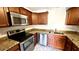 Updated kitchen with granite counters and stainless steel appliances at 3419 Clark Rd # 120, Sarasota, FL 34231