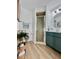 Modern bathroom with green vanity, shower, and stylish decor at 3504 Beneva Rd # 206, Sarasota, FL 34239