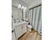 Updated bathroom with white vanity, shower/tub combo, and a light and airy feel at 3504 Beneva Rd # 206, Sarasota, FL 34239