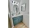 Clean bathroom with teal vanity, white walls, and updated fixtures at 3504 Beneva Rd # 206, Sarasota, FL 34239