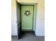Condo entry with a light green door and a lovely wreath at 3504 Beneva Rd # 206, Sarasota, FL 34239