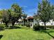 Residential building with green lawn and mature trees at 3504 Beneva Rd # 206, Sarasota, FL 34239