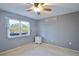 Bedroom with ceiling fan, nightstand and window at 3620 Ironwood Cir # 206O, Bradenton, FL 34209