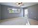Bedroom with sliding door to balcony and ceiling fan at 3620 Ironwood Cir # 206O, Bradenton, FL 34209