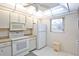 Efficient kitchen with white cabinets and modern appliances at 3620 Ironwood Cir # 206O, Bradenton, FL 34209