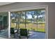 Spacious lanai with sliding doors offering scenic views at 3620 Ironwood Cir # 206O, Bradenton, FL 34209