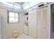 Bright laundry room with washer, dryer, and storage at 3620 Ironwood Cir # 206O, Bradenton, FL 34209