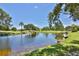 Serene pond view in a lush, green community at 3620 Ironwood Cir # 206O, Bradenton, FL 34209