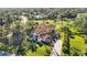 Luxury home with tile roof and lush landscaping situated on a golf course at 401 Walls Way, Osprey, FL 34229
