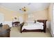 Spacious bedroom with a large bed, desk, and window at 401 Walls Way, Osprey, FL 34229
