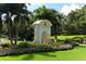 The Oaks Club entrance features a grand archway and an eagle statue at 401 Walls Way, Osprey, FL 34229