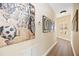 Hallway with artwork and hardwood floors at 401 Walls Way, Osprey, FL 34229