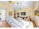 Living room with sectional sofa and hardwood floors at 401 Walls Way, Osprey, FL 34229