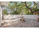 Charming brick patio with a tiered fountain and lush landscaping at 401 Walls Way, Osprey, FL 34229