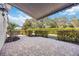 Covered patio with brick paving, providing shade and a tranquil setting at 401 Walls Way, Osprey, FL 34229