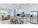 Modern kitchen with breakfast bar and dining area at 406 Wildlife Gln, Bradenton, FL 34209