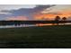 Scenic sunset view over the tranquil lake at 406 Wildlife Gln, Bradenton, FL 34209