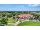 Aerial view of clubhouse, golf course, and landscape at 4211 Palacio Dr, Sarasota, FL 34238