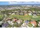 Luxury homes community with golf course, and houses with solar panels at 4211 Palacio Dr, Sarasota, FL 34238