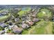 Bird's-eye view of upscale homes and a lush golf course at 4211 Palacio Dr, Sarasota, FL 34238