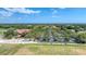 Aerial view of clubhouse, parking lot, and golf course at 4211 Palacio Dr, Sarasota, FL 34238