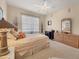 Serene bedroom with a dresser and ceiling fan at 4211 Palacio Dr, Sarasota, FL 34238