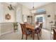 Spacious dining area with a large wooden table, chairs, and a china cabinet at 4211 Palacio Dr, Sarasota, FL 34238