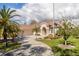 Beautiful home with three-car garage and lush landscaping at 4211 Palacio Dr, Sarasota, FL 34238