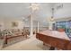 Spacious game room featuring a pool table and relaxing sitting area at 4211 Palacio Dr, Sarasota, FL 34238