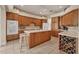 Spacious kitchen with ample counter space, wood cabinets, and island with seating at 4211 Palacio Dr, Sarasota, FL 34238