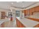 Large kitchen with an island, breakfast bar, and views to the backyard and pool at 4211 Palacio Dr, Sarasota, FL 34238