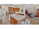Open kitchen with island, breakfast bar, and views into the Gathering room at 4211 Palacio Dr, Sarasota, FL 34238