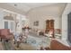 Bright and airy living room with high ceilings and access to other rooms at 4211 Palacio Dr, Sarasota, FL 34238