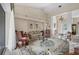 Open living area with high ceilings, comfy seating, and a view into the entryway at 4211 Palacio Dr, Sarasota, FL 34238