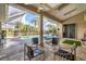 Inviting pool area with patio furniture under a screened enclosure at 4211 Palacio Dr, Sarasota, FL 34238