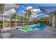 Large screened pool and spa area with a spacious patio at 4211 Palacio Dr, Sarasota, FL 34238
